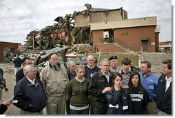 President George W. Bush talks with the media after walking through the tornado damage at Enterprise High School in Enterprise, Ala., Saturday, March 3, 2007. "And today I have walked through devastation that's hard to describe," said the President. "Our thoughts, of course, go out to the students who perished. We thank God for the hundreds who lived." White House photo by Paul Morse