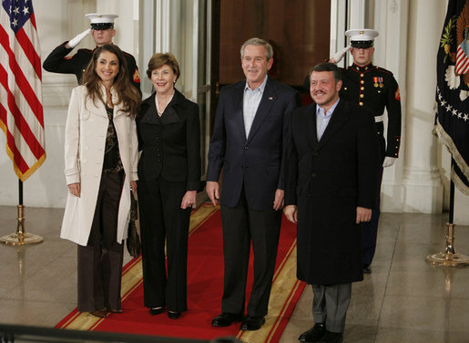 President George W. Bush and Mrs. Laura Bush welcome Jordan's King Abdullah II and Queen Rania upon their arrival to the White House for a social dinner Tuesday evening, March 6, 2007. White House photo by Paul Morse