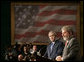 President George W. Bush listens intently to remarks by President Luiz Inacio Lula da Silva of Brazil during a joint press availability Friday, March 9, 2007, in Sao Paulo. White House photo by Eric Draper