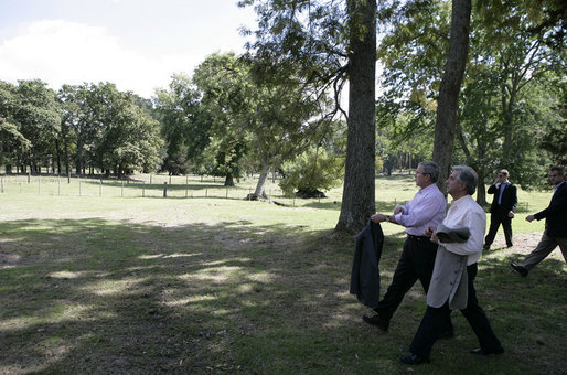 President George W. Bush and President Tabare Vazquez of Uruguay shed their sport jackets Saturday, March 10, 2007, for a walking tour of Estancia Anchorena, the Uruguayan leader's presidential retreat. White House photo by Eric Draper