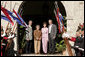President George W. Bush and Mrs. Laura Bush stand for photos Saturday, March 10, 2007, with President Tabare Vazquez of Uruguay and his wife, Mrs. Maria Auxiliadora Delgado de Vazquez at Estancia Anchorena. The President and Mrs. Bush will overnight in nearby Montevideo before continuing on to Colombia for the fourth stop of their five-country, Latin American visit. White House photo by Paul Morse
