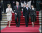 President George W. Bush and Mrs. Laura Bush wave goodbye with President Alvaro Uribe and First Lady Lina Moreno de Uribe of Columbia at the end of their visit to the Presidential Palace in Bogotá, Colombia, Sunday, March 11, 2007. White House photo by Eric Draper