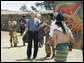 President George W. Bush tests his skills as he joins athletes in a Mayan Ritual Competition during a tour Monday, March 12, 2007, to Iximche, Guatemala. White House photo by Eric Draper