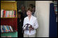 Mrs. Laura Bush holds a gift of books for the Dr. Richard Carroll Municipal Library during a tour of the facility Monday, March 12, 2007, in Santa Cruz Balanya, Guatemala. White House photo by Paul Morse