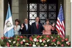 President George W. Bush and Mrs. Laura Bush and President Oscar Berger of Guatemala, and Mrs. Wendy Widmann de Berger wave to the audience Monday, March 12, 2007, during the arrival ceremonies at the Palacio Nacional de la Cultura in Guatemala City. White House photo by Paul Morse