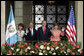 President George W. Bush and Mrs. Laura Bush and President Oscar Berger of Guatemala, and Mrs. Wendy Widmann de Berger wave to the audience Monday, March 12, 2007, during the arrival ceremonies at the Palacio Nacional de la Cultura in Guatemala City. White House photo by Paul Morse