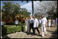 President George W. Bush and Mrs. Laura Bush walk with President Felipe Calderon and Mrs. Margarita Zavala to the arrival ceremonies Tuesday, March 13, 2007, in Temozon Sur, Mexico. The President and Mrs. Bush are on the final leg of their five-country, Latin American visit, and are scheduled to return to Washington Wednesday. White House photo by Paul Morse
