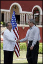 President George W. Bush exchanges handshakes with Felipe Calderon, President of Mexico, during the arrival ceremonies Tuesday, March 13, 2007, welcoming the President and Mrs. Bush to the country. President Calderon told the President, "Mr. President, I have no doubt that together our governments will move forward in the generation of new opportunities of well-being and prosperity for our nations. Please feel very, very welcome to Mexico." White House photo by Paul Morse