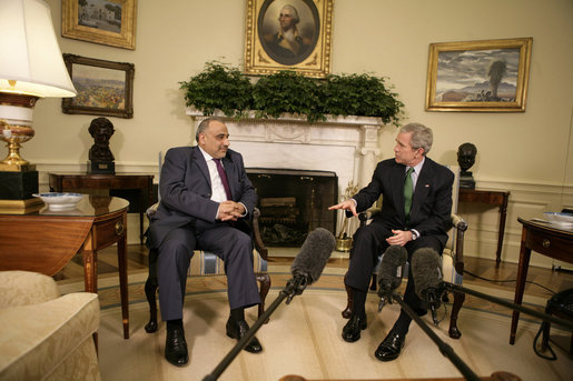 President George W. Bush talks with Iraqi Vice President Adil Abd Al-Mahdi, Thursday, March 15, 2007, during a meeting with the press in the Oval Office. "You, Mr. Vice President, are showing strong vision, and a vision of peace and reconciliation," said President Bush, adding, "And I welcome you to the Oval Office. I thank you for your courage, and I thank you for the conversation we've had." White House photo by Eric Draper