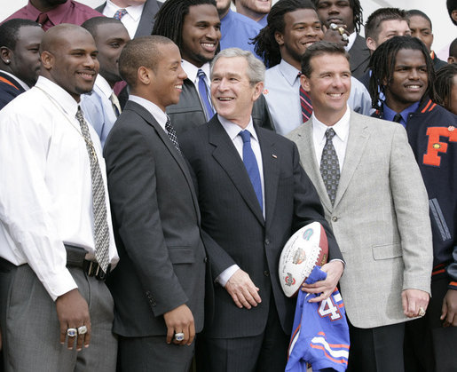 President George W. Bush is joined by University of Florida Gators football coach Urban Meyers, right, and team quarterback Chris Leak during ceremonies at the White House, Monday, March 19, 2007, to honor the 2006 NCAA football championship team. White House photo by Eric Draper