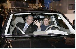 President George W. Bush sits in a hybrid Ford Escape with Barbara Neal, an employee of the Ford Motor Company - Kansas City Assembly Plant in Claycomo, Missouri Tuesday, March 20, 2007. The President took the opportunity to deliver remarks on Energy Initiatives during the Midwest stop.  White House photo by Eric Draper