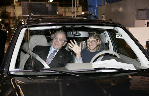 President George W. Bush sits in a hybrid Ford Escape with Barbara Neal, an employee of the Ford Motor Company - Kansas City Assembly Plant in Claycomo, Missouri Tuesday, March 20, 2007. The President took the opportunity to deliver remarks on Energy Initiatives during the Midwest stop. White House photo by Eric Draper