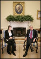 President George W. Bush and Prime Minister Helen Clark of New Zealand talk to reporters during their meeting in the Oval Office Wednesday, March 21, 2007. White House photo by Eric Draper