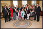 President George W. Bush and Mrs. Laura Bush pose for a photo with the family of former President Lyndon Baines Johnson in the Oval Office, Friday, March 23, 2007, following the signing of H.R. 584 designating the U.S. Department of Education in Washington, D.C., as the Lyndon Baines Johnson Federal Building. White House photo by Eric Draper