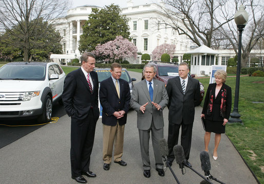 President George W. Bush talks to the media after a demonstration Monday, March 26, 2007, of alternative fuel vehicles on the South Lawn drive of the White House. Standing with him from left, are: Rick Wagoner, Chairman and CEO, General Motors Corporation; Alan Mulally, President and CEO, Ford Motor Company; Tom LaSorda, President and CEO, DaimlerChrysler Corporation, and Secretary of Transportation Mary Peters. White House photo by Joyce Boghosian