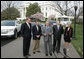 President George W. Bush talks to the media after a demonstration Monday, March 26, 2007, of alternative fuel vehicles on the South Lawn drive of the White House. Standing with him from left, are: Rick Wagoner, Chairman and CEO, General Motors Corporation; Alan Mulally, President and CEO, Ford Motor Company; Tom LaSorda, President and CEO, DaimlerChrysler Corporation, and Secretary of Transportation Mary Peters. White House photo by Joyce N. Boghosian