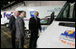 President George W. Bush and Secretary of Energy Sam Bodman listen to Mark Chernoby as the Vice President of Advance Vehicle Engineering at DaimlerChrysler describes the FedEx Pilot Program Plug-in Hybrid Sprinter during the President's visit Tuesday, March 27, 2007, to the U.S. Postal Service Vehicle Maintenance Facility in Washington, D.C. White House photo by Joyce Boghosian