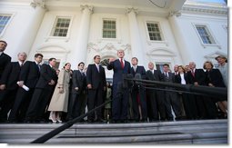 President George W. Bush is surrounded by members of the House Republican Conference on the steps of the North Portico Thursday, March 29, 2007, as he delivers a statement on the budget and the emergency supplemental after meeting with the group. Said the President, "We stand united in saying loud and clear that when we've got a troop in harm's way, we expect that troop to be fully funded; and we've got commanders making tough decisions on the ground, we expect there to be no strings on our commanders; and that we expect the Congress to be wise about how they spend the people's money."  White House photo by Eric Draper