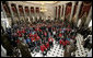 President George W. Bush and Speaker of the House of Representatives Nancy Pelosi stand amidst 300 Tuskegee Airmen during a photo opportunity Thursday, March 29, 2007, in Statuary Hall at the U.S. Capitol. White House photo by Joyce Boghosian