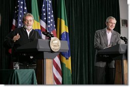 President George W. Bush listens as Brazilian President Luiz Inacio Lula da Silva answers a reporter’s question during their joint news conference Saturday, March 31, 2007, at Camp David.  White House photo by Eric Draper