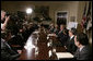 President George W. Bush addresses his remarks to members of the media during a meeting with small business owners, health insurance providers and recently insured individuals on Health Savings Accounts, Monday, April 2, 2007, in the Roosevelt Room at the White House. A report released Monday shows the number of individuals covered by Health Savings Accounts has increased 43 percent over the last year. White House photo by Joyce Boghosian