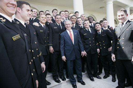 President George W. Bush meets with members of the U. S. Naval Academy football team, after presenting the team with the Commander-In-Chief trophy at the White House, Monday, April 2, 2007. White House photo by Eric Draper