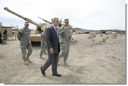President George W. Bush talks with U.S. Army Captain Pat Armstrong during his visit to the U.S. Army National Training Center Wednesday, April 4, 2007, at Fort Irwin, Calif.  White House photo by Eric Draper