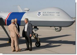 Standing next to a Predator Drone, Maj. Gen. Mike Kostelnik speaks with President George W. Bush and Secretary Michael Chertoff of Homeland Security during their tour Monday, April 9, 2007, of the U.S.-Mexico border in Yuma, Ariz. Said the President, "It's the most sophisticated technology we have, and it's down here on the border to help Border Patrol agents do their job."  White House photo by Eric Draper