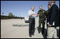 President George W. Bush emphasizes a point Monday, April 9, 2007, as he stands with Chief Border Patrol Agent Ron Colburn, center, and others during a tour of the U.S.-Mexico border in Yuma, Ariz. White House photo by Eric Draper