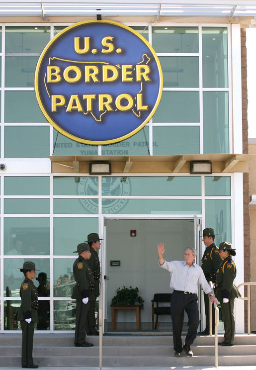 President George W. Bush waves from the new Yuma Border Patrol Station building Monday, April 9, 2007, during his visit to the Arizona border community to speak on immigration reform. The President told his audience, "We need to work together to come up with a practical solution to this problem, and I know people in Congress are working hard on this issue." White House photo by Eric Draper