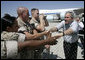 President George W. Bush reaches out to Marines as he prepares to depart the Yuma Marine Corps Air Station in Yuma, Ariz. The stop in the border city was the last before returning to Washington, D. C. after a Easter weekend in Texas. White House photo by Eric Draper