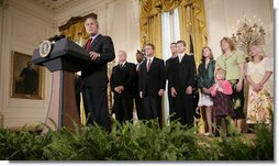 President George W. Bush, joined by military family members, addresses his remarks on the Iraq War supplemental spending bill in the East Room at the White House, Monday, April 16, 2007. President Bush urged Congress to pass an emergency war spending bill, without strings and without further delay.  White House photo by Eric Draper