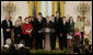 President George W. Bush, joined by military family members, addresses his remarks on the Iraq War supplemental spending bill in the East Room at the White House, Monday, April 16, 2007. President Bush urged Congress to pass an emergency war spending bill, without strings and without further delay. White House photo by Joyce Boghosian