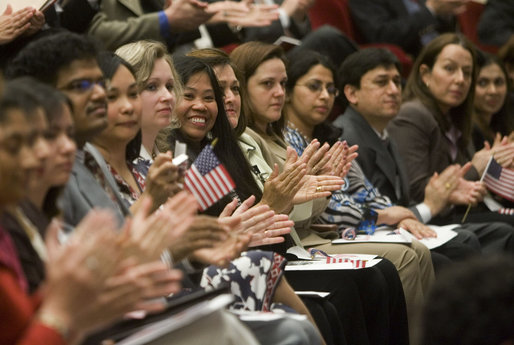 Arlene Oftedahl of Burke, Va., center, is all smiles as she and some of America’s newest citizens applaud Mrs. Cheney as she delivers her remarks during a special naturalization ceremony at the National Archives Tuesday, April 17, 2007, in Washington, D.C. 