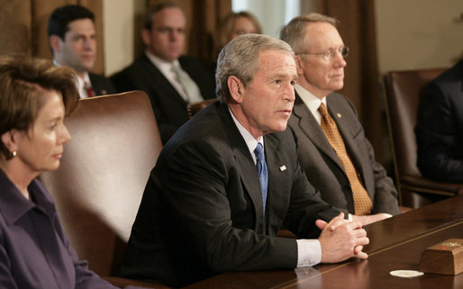 President George W. Bush talks with reporters at the start of his meeting with bicameral and bipartisan legislative leaders, including House Speaker Nancy Pelosi, left, and Senate Majority Leader Harry Reid, in the Cabinet Room at the White House, Wednesday, April 18, 2007. White House photo by Eric Draper