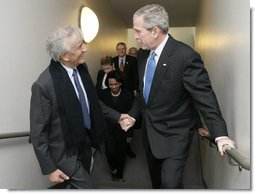 President George W. Bush is greeted by Elie Wiesel, Founding Chairman of the United States Holocaust Memorial Museum, after arriving Wednesday, April 18, 2007, to deliver remarks in commemoration of the Holocaust Days of Remembrance.  White House photo by Eric Draper