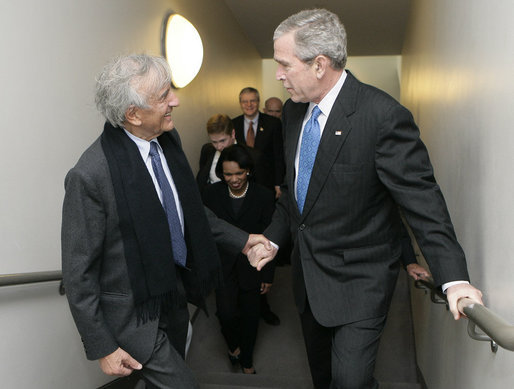 President George W. Bush is greeted by Elie Wiesel, Founding Chairman of the United States Holocaust Memorial Museum, after arriving Wednesday, April 18, 2007, to deliver remarks in commemoration of the Holocaust Days of Remembrance. White House photo by Eric Draper