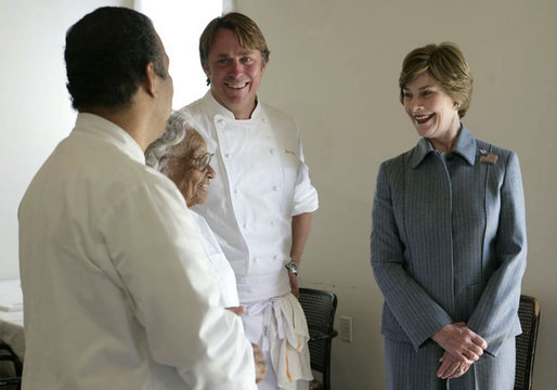Mrs. Laura Bush talks with 93-year-old restaurant owner Willie Mae Seaton, center, her grandson Ronnie Seaton, Sr., left, and Chef John Besh of Restaurant August at Willie Mae’s Scotch House Thursday, April 19, 2007, in New Orleans, La. The restaurant was destroyed in Hurricane Katrina. White House photo by Shealah Craighead