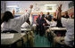 Students in the seventh grade science class at Harlem Village Academy Charter School in New York, raise their hands to answer a question posed by President George W. Bush during his visit to the school Tuesday, April 24, 2007. White House photo by Eric Draper