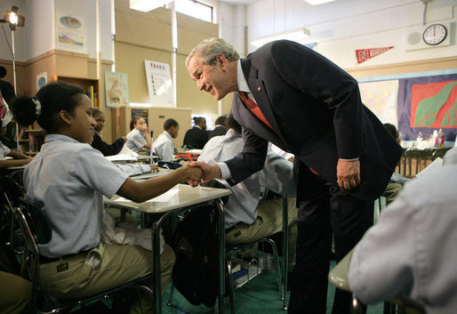 President George W. Bush meets students in the seventh grade science class at Harlem Village Academy Charter School in New York, during his visit to the school Tuesday, April 24, 2007, where President Bush spoke about his "No Child Left Behind" reauthorization proposals. White House photo by Eric Draper