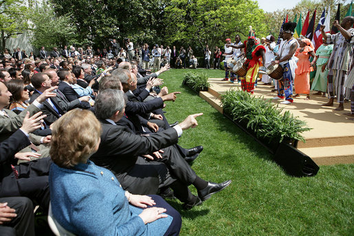 The audience takes part in a performance by the Kankouran West African Dance Company during a ceremony marking Malaria Awareness Day Wednesday, April 25, 2007, in the Rose Garden. White House photo by Eric Draper