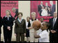 Mrs. Laura Bush, joined by Ambassador Karen Hughes left, and Linda Hargrove, general manager of the Washington Mystics, watches students playing basketball Wednesday, April 25, 2007, at the Friendship Public Charter School on the Woodridge Elementary and Middle School campus in Washington, D.C. Mrs. Bush visited the school to participate in Malaria Awareness Day events. White House photo by Shealah Craighead