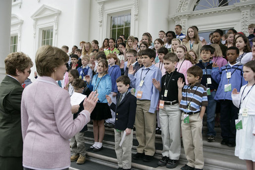 Mrs. Laura Bush is joined by Mary Bomar, director of the National Park Service, as a group of youngsters participating in the 2007 Bring Your Child to Work Day at the White House take the Junior Ranger pledge Thursday, April 26, 2007, on the steps of the North Portico of the White House. The Junior Ranger program, sponsored by the National Park Service, educates young people about the nation's various and diverse national parks. White House photo by Shealah Craighead