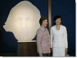 Mrs. Laura Bush and Mrs. Akie Abe, wife of Japanese Prime Minister Shinzo Abe, stand before a portrait of George Washington as they talk to members of the media, following a tour of the Mount Vernon Estate of George Washington Thursday, April 26, 2007, in Mount Vernon, Va. White House photo by Shealah Craighead
