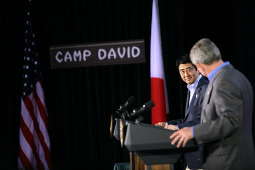 President George W. Bush and Prime Minister Shinzo Abe of Japan exchange nods as they open a joint press availability Friday, April 27, 2007, at Camp David. The meeting marked the first visit by Prime Minister Abe since coming to office. White House photo by Eric Draper