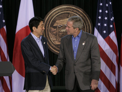 President George W. Bush exchanges handshakes with Prime Minister Shinzo Abe of Japan after their joint press availability Friday, April 27, 2007, at Camp David. White House photo by Joyce Boghosian