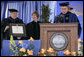 Mrs. Laura Bush receives an honorary Doctor of Laws degree from Dr. Andrew K. Benton, President of Pepperdine University Saturday, April 28, 2007, as Pepperdine Board of Regents member Eff W. Martin, delivers the Conferring Statement. The presentation came during the commencement ceremonies for the Class of 2007 at Pepperdine's Seaver College in Malibu. White House photo by Shealah Craighead