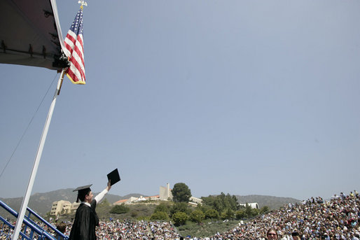 A graduate of the University of Pepperdine's Seaver College raises his diploma Saturday, April 28, 2007, during commencement ceremonies in Malibu, California. The event was highlighted by an address from Mrs. Laura Bush, who also received an honorary Doctor of Laws degree from the school. White House photo by Shealah Craighead