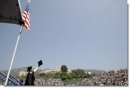 A graduate of the University of Pepperdine's Seaver College raises his diploma Saturday, April 28, 2007, during commencement ceremonies in Malibu, California. The event was highlighted by an address from Mrs. Laura Bush, who also received an honorary Doctor of Laws degree from the school. White House photo by Shealah Craighead