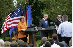 President George W. Bush, European Council President Angela Merkel of Germany and European Commission President Jose Manuel Barroso of Portugal listen to a question Monday, April 30, 2007, during a joint press conference in the Rose Garden.  White House photo by Eric Draper